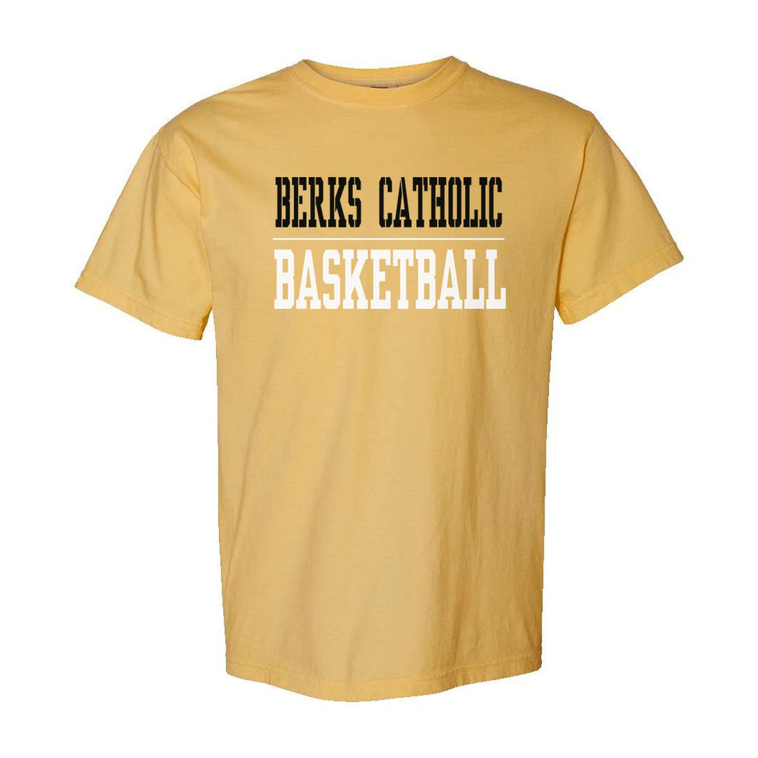Berks Catholic Saints Sport or Activity comfort colors t-shirt in Mustard: BERKS CATHOLIC over a thin rule and BASKETBALL (your sport or activity) in block letters