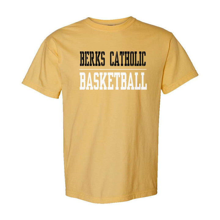 Berks Catholic Saints Sport or Activity comfort colors t-shirt in Mustard: BERKS CATHOLIC over a thin rule and BASKETBALL (your sport or activity) in block letters