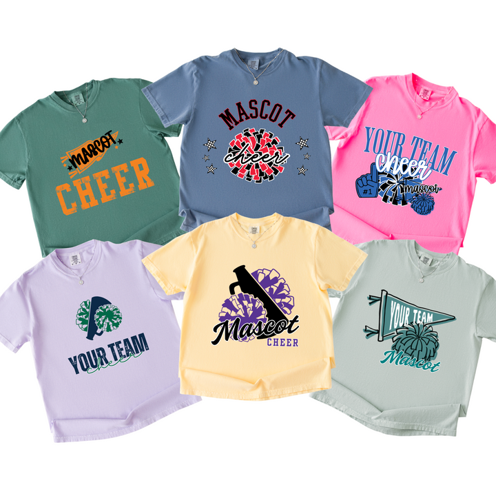 Six custom cheer t-shirts on garment-dyed Comfort Colors in light green, blue jean, neon pink, orchid, butter and seafoam, each with a different cheer design in that school&