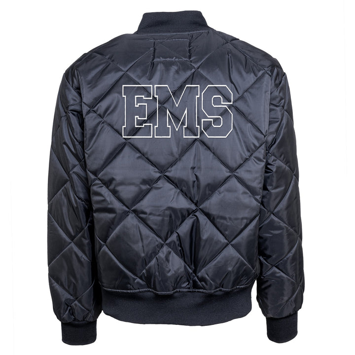 Back of navy diamond quilted jacket with EMS embroidered in outlined block letters across the upper back