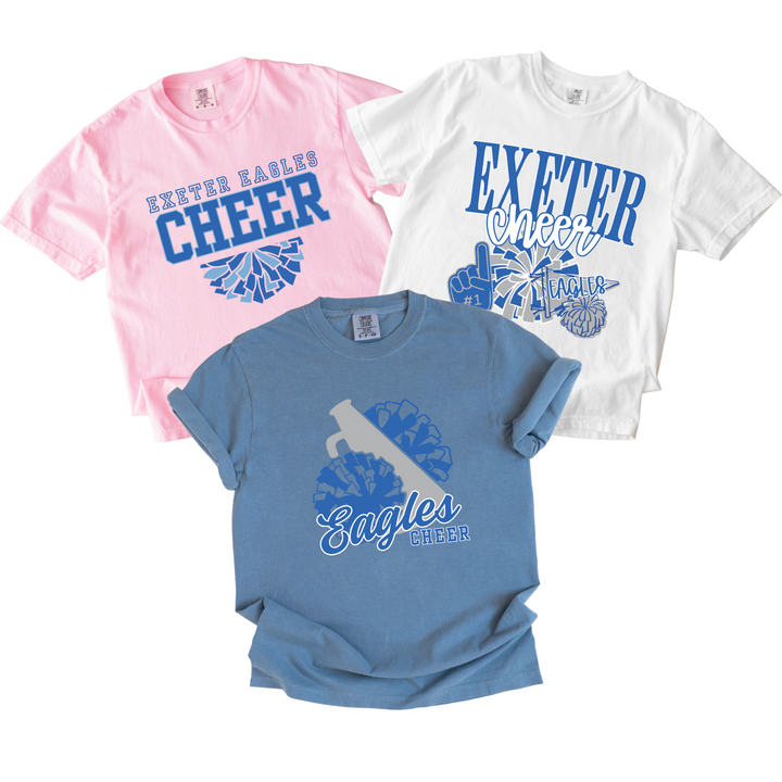 Three Exeter Eagles cheer t-shirts on garment-dyed Comfort Colors in blossom pink, white and blue jean, each with a different Eagles cheer design in blue and grey