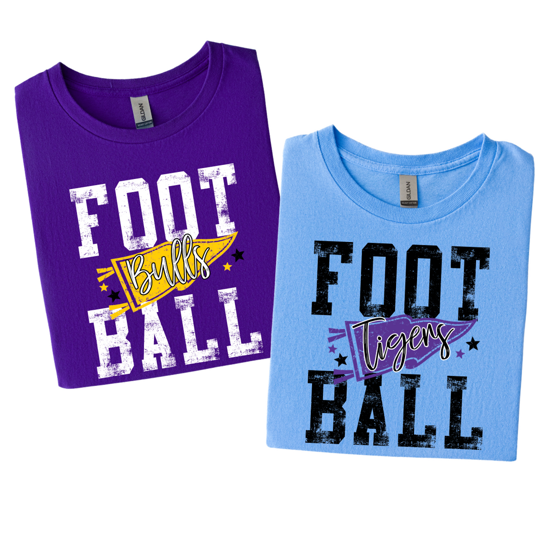 Football pennant t-shirts folded flat: purple tee with a gold Bulls pennant and light blue tee with a purple Tigers pennant