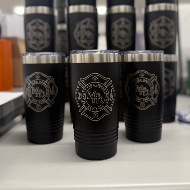 Black 20 oz tumblers laser engraved with a fire department patch