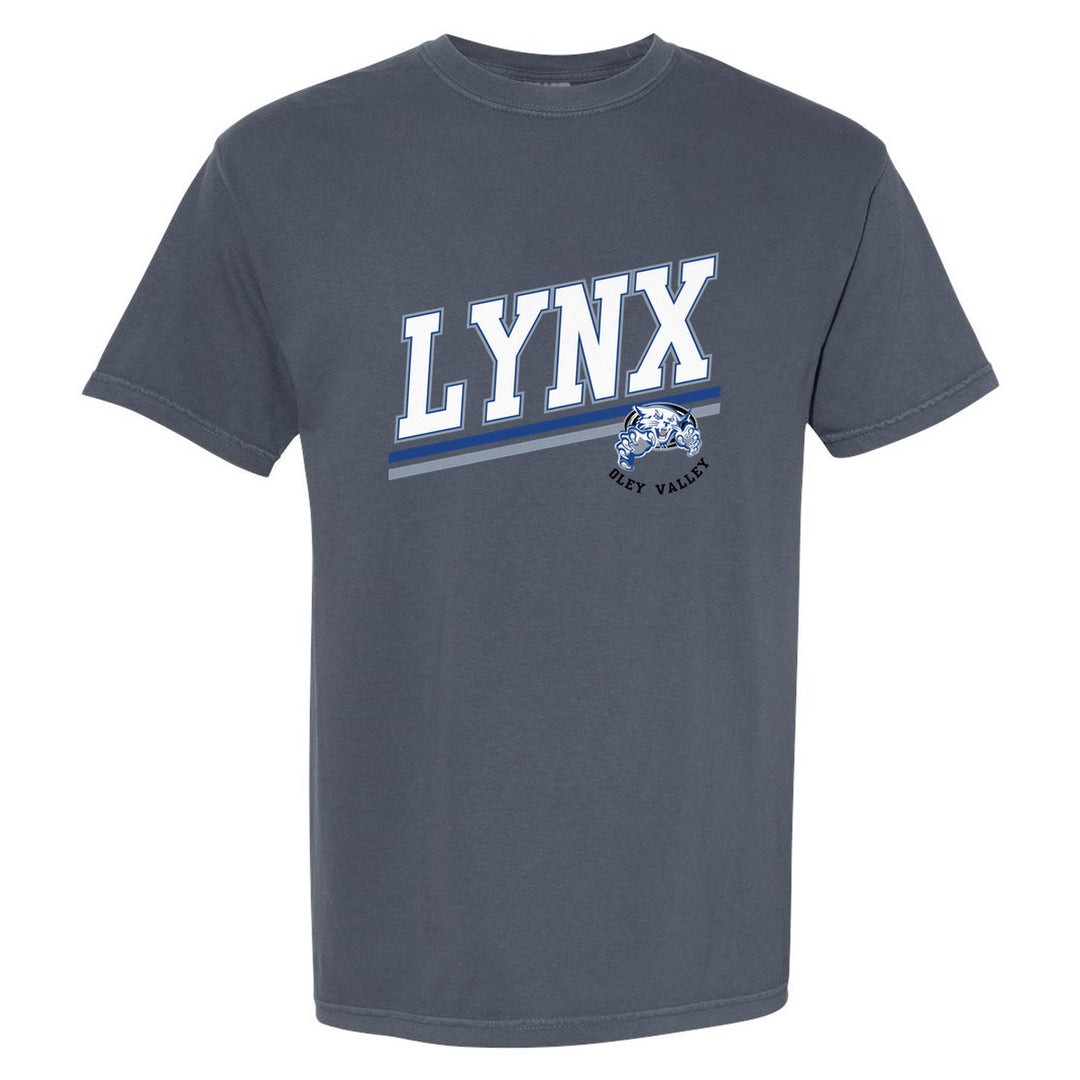 Oley Valley Lynx Slanted Stripe comfort colors t-shirt in Denim: bold varsity LYNX lettering over a slanted double stripe, with a small lynx mascot badge and Oley Valley