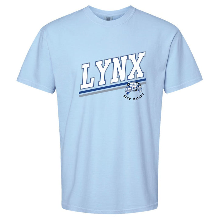 Oley Valley Lynx Slanted Stripe comfort colors t-shirt in Hydrangea: bold varsity LYNX lettering over a slanted double stripe, with a small lynx mascot badge and Oley Valley