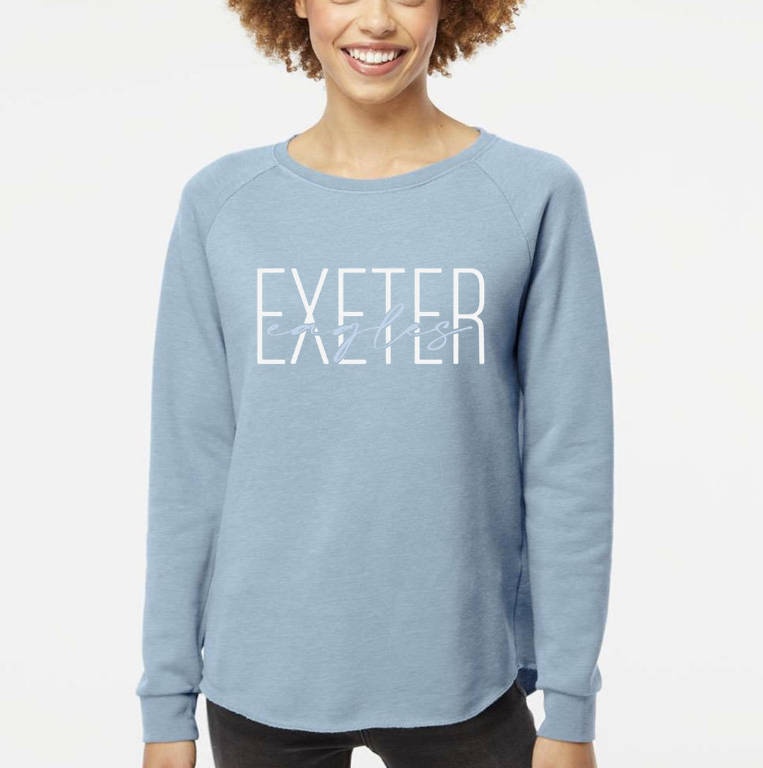 Model wearing the Exeter Eagles wave wash crew in Misty Blue with the script overlay design